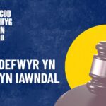 Text reads 'Dioddefwyr yn derbyn iawndal'